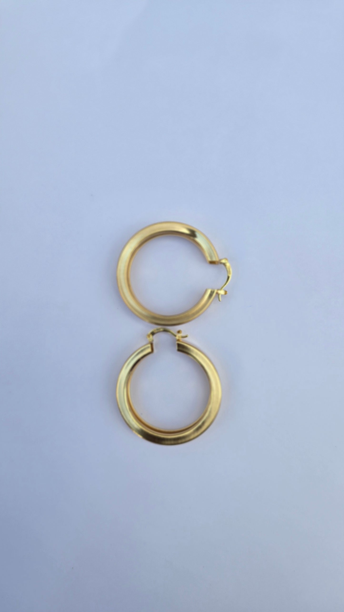 Bold gold hoop earrings