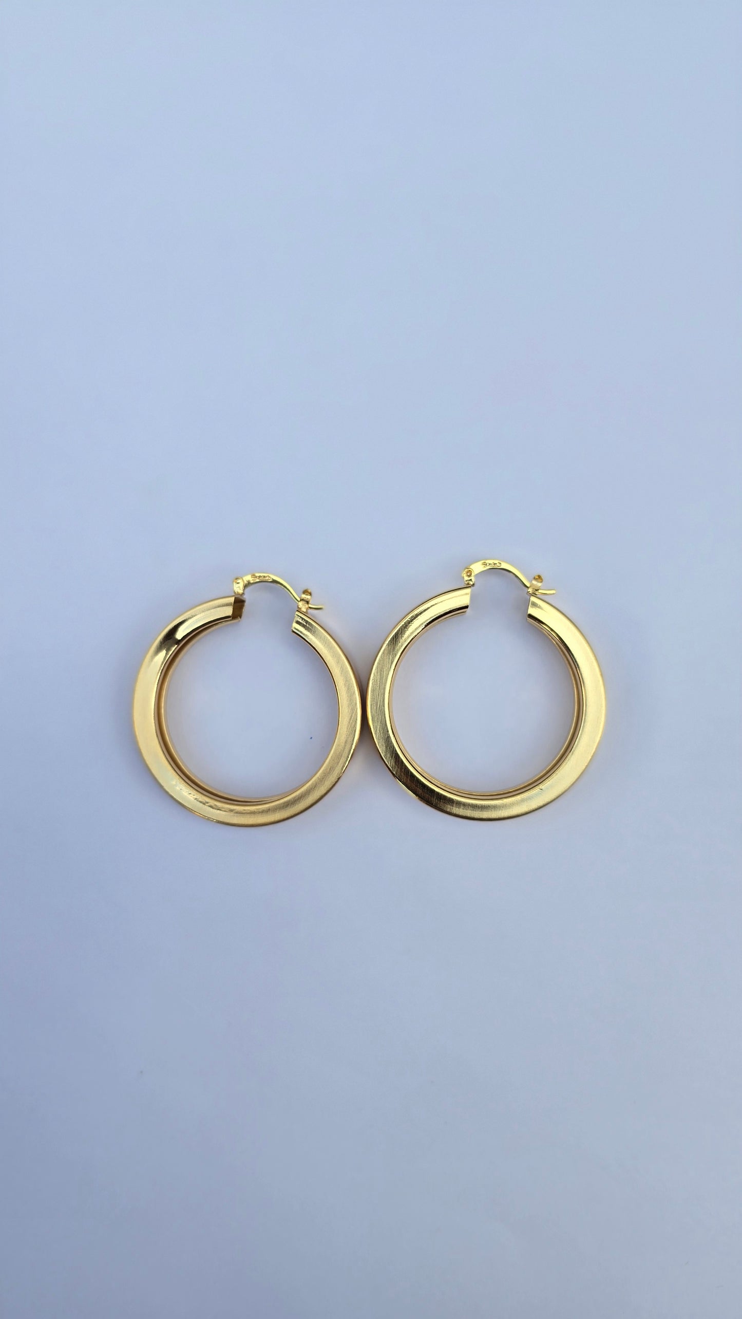 Bold gold hoop earrings